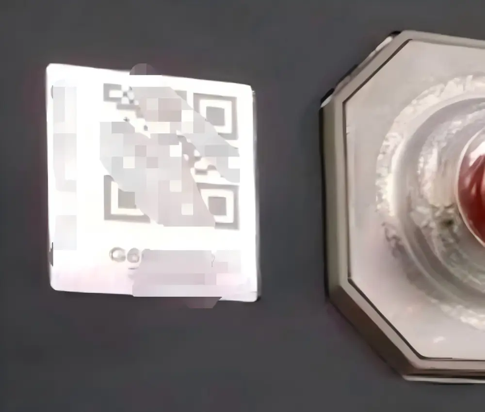 2. worker inspecting EVE 100Ah cell surface for defects