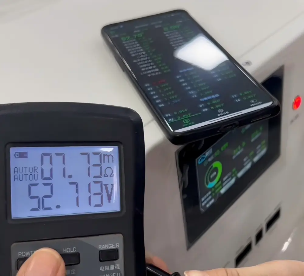 worker checking 16kWh battery pack terminals